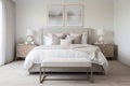 A Scandinavian-inspired bedroom with a luxurious upholstered bed, crisp white linens, and soft neutral tones. Royalty Free Stock Photo