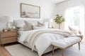 A Scandinavian-inspired bedroom with a luxurious upholstered bed, crisp white linens, and soft neutral tones. Royalty Free Stock Photo