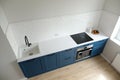 Scandinavian interior design. Small kitchen room with blue cabinets and white countertop, Nordic kitchen top view. White tiles on Royalty Free Stock Photo