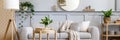 Scandinavian living room interior with design grey sofa, wooden coffee table, tropical plants, shelf, mirror, furniture, plaid. Royalty Free Stock Photo