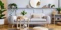 Scandinavian living room interior with design grey sofa, wooden coffee table, tropical plants, shelf, mirror, furniture, plaid. Royalty Free Stock Photo