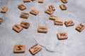 Scandinavian magic runes made of oak on concrete.