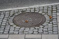 Scandinavian manhole in its urban surrounding.