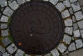 Scandinavian manhole in its urban surrounding.