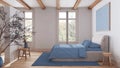 Scandinavian nordic wooden bedroom in white and blue tones. Double bed with duvet and decors. Beams ceiling and parquet floor. Royalty Free Stock Photo