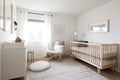 scandinavian nursery with minimalist crib, dresser and nightstand Royalty Free Stock Photo