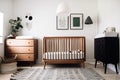 scandinavian nursery with minimalist crib, dresser and nightstand Royalty Free Stock Photo