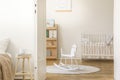 Scandinavian nursery with white wooden crib, with copy space Royalty Free Stock Photo