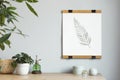 Scandinavian room interior with mock up photo frame on the bamboo table with beautiful plants in differents pots. Royalty Free Stock Photo