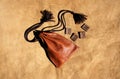 Scandinavian runes made from leather and leather bag with picture of dragon on it