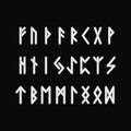 Scandinavian runes white letters on black background. Runic alphabet. Ancient occult symbols.