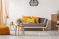 Scandinavian sofa with pillows in a bright living room interior. Cozy home room design. Generative AI Royalty Free Stock Photo