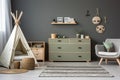 scandinavian-style childs room with wooden furniture