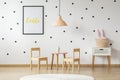 Scandinavian style cupboard and a wooden toy dining set in a cut Royalty Free Stock Photo