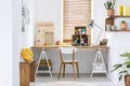 Scandinavian style hobby room interior with workspace for knitting, sewing, crocheting and designing handmade home textiles. Real