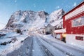 Scandinavian village with snowing and snow mountain at Lofoten