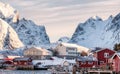 Scandinavian village in snowy valley at sunrise morning