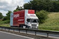 Scania G450 truck with a trailer of Home Bargain company on a Scottish highway with motion blur effect when delivering goods