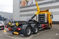 SCANIA G410 XT - special vehicle with PALFINGER hooklifts system and with CNG engine, rear view. WasteTech 2021 exhibit Royalty Free Stock Photo