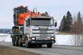 Scania 143M Truck Hauls Excavator