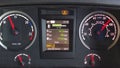 Scania R450 heavy truck dashboard in action showing fuel consumption of 11mpg