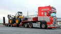 Scania R500 Truck Hauling a Forest Harvester