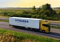 SCANIA Semi Truck by VITRANSA on highway on sunset background. Shipping Containers, Maritime logistics. RUSSIA, MOSCOW - SEPT 12,