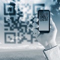 Scanning Qr code with mobile smart phone Royalty Free Stock Photo