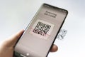 Scanning QR code with mobile smart phone. all graphics on the screen are made up Royalty Free Stock Photo