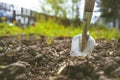 Scapula on the background of fertile soil. Place for the text. The concept of agriculture. Metal garden tools Royalty Free Stock Photo