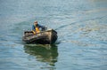 Man in small fishing boat in Scarborough, North Yorkshire on July 18, 2022. Royalty Free Stock Photo