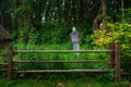 Scare crow village garden scenic view back yard of house and rural palisade in green foliage environment space