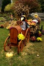 Scarecrow driving tractor fall decorations Royalty Free Stock Photo