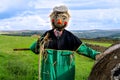 Scarecrow in a farmers field happy smiling face wearing a flat cap Royalty Free Stock Photo