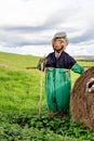 Scarecrow in a farmers field happy smiling face wearing a flat cap Royalty Free Stock Photo