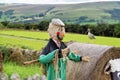 Scarecrow in a farmers field happy smiling face wearing a flat cap Royalty Free Stock Photo