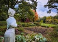 A Scarecrow looking out over a garden at the Ethan Allen Homestead