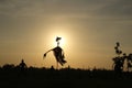 Scarecrow silhouette on sun background Royalty Free Stock Photo