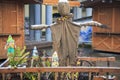 Scarecrow strawman, for dispersing birds Royalty Free Stock Photo