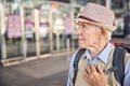 Scared aged Caucasian traveler looking at something