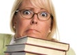 Scared Attractive Woman with Stack of Books Royalty Free Stock Photo
