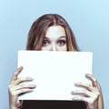 Scared business woman hide face with white sign board. Royalty Free Stock Photo