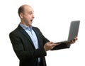 Scared businessman with his laptop computer Royalty Free Stock Photo