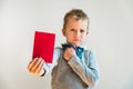 Scared child with red anti bullying card