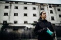 Scared devastated woman holding protective mask.Activities in time of epidemic/pandemic.Panic and fear of infection.