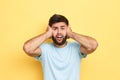 Scared emotional businessman in blue shirt touching his head