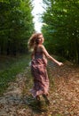 Scared girl running through forest Royalty Free Stock Photo