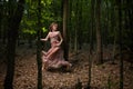 Scared girl running through forest Royalty Free Stock Photo