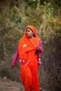 Scared indian female red sari