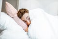 Scared man hiding under the bedsheets Royalty Free Stock Photo